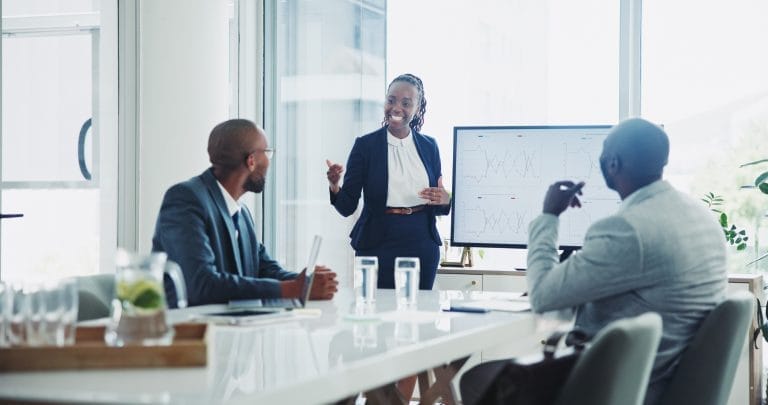 Business, people and presentation in office on meeting and workshop as accountant. Teamwork, collaboration and happy or smile with feedback, review and target report or company growth and client